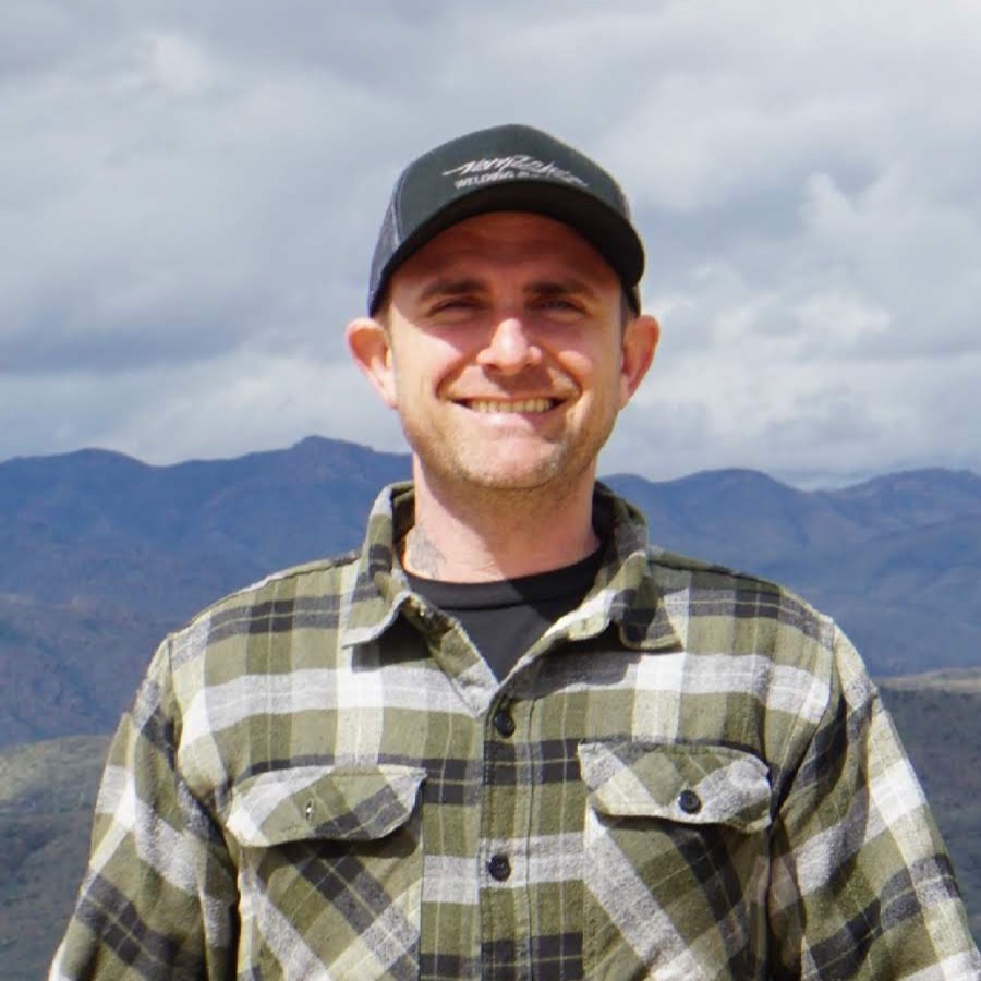 Portrait of Chris Follin in the mountains