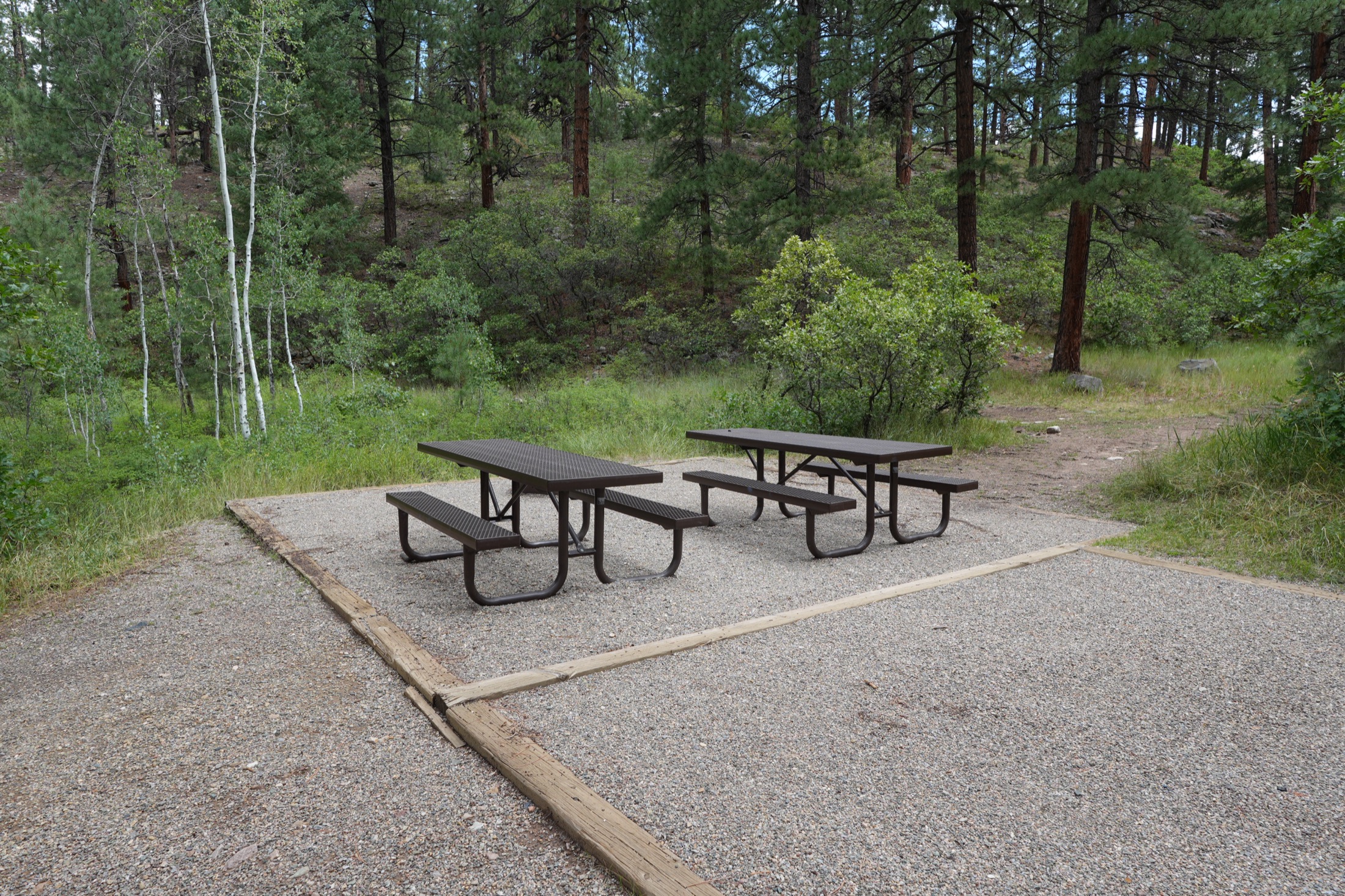 Picnic tables at a spacious Haviland Lake campsite