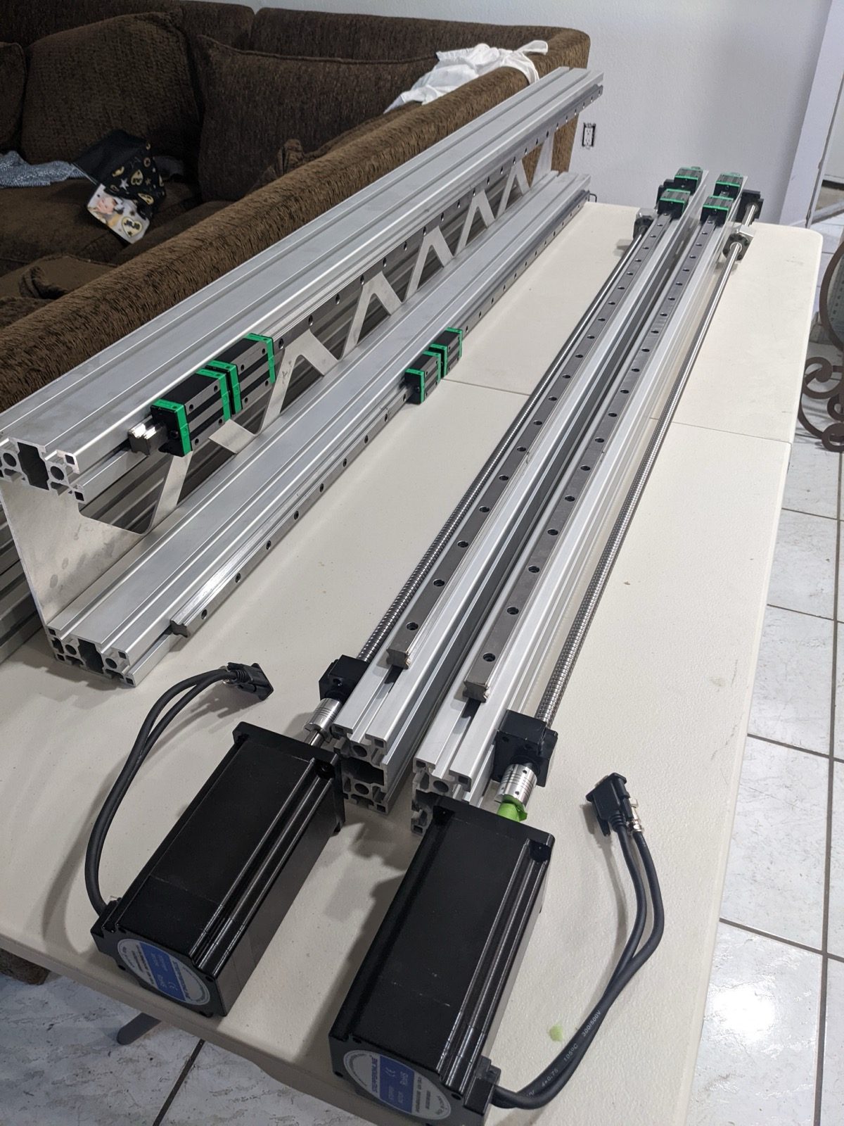 Linear rails aligned along the aluminum extrusion frame